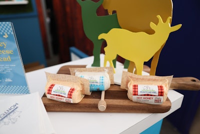 Meanwhile, Montchevre offered hot honey goat cheese samples at a farm-inspired booth, complete with goat figurines. Both brands worked with Evolve Concepts to design the booths.