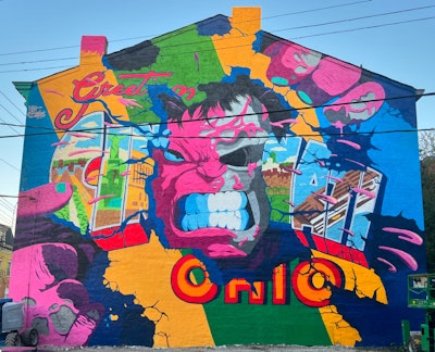 Matt Gondek, who designed this mural, also hosted an episode of his podcast, Clean Break, during the summit.