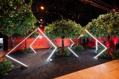 The entire event was built for content capture, with specific areas designed to encourage social sharing. These included the 'Big Apple Orchard Catwalk,' a dramatic walk-through experience complete with glowing arches and a slow-motion video setup that turned every guest into a RHONY star.