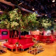 The team aimed to merge the natural beauty of the orchard with the luxurious RHONY aesthetic, incorporating red velvet lounges, gold and mirrored tables, and glamorous bars. 'Lots of people commented how they felt like they were walking into a real orchard and how beautiful the space looked,' Skonieczny said. 'I heard quite a few comments on how it was one of the most incredible transformations they have seen at the Chelsea Factory.'