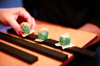 The menu emphasized—you guessed it—apple flavors. Attendees enjoyed passed hors d'oeuvres like basil-crusted filet mignon, spicy tuna, and a 'Caesar salad eruption.' For dessert, options included apple tarts and cranberry caviar. The bar featured two specialty cocktails: The Big Martini, made with green apple, and a red mocktail dubbed the Red Hot RHONY.