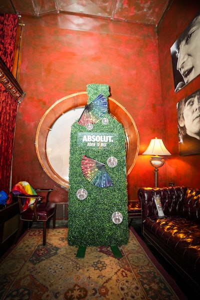 Decor included a hedge sculpture shaped like an Absolut bottle, outfitted with rainbow fans and disco balls.
