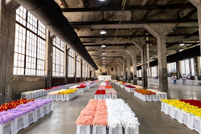 CJ Hendry’s vibrant floral installation found a new home at Industry City’s 19,000-square-foot industrial event space, Box Factory.