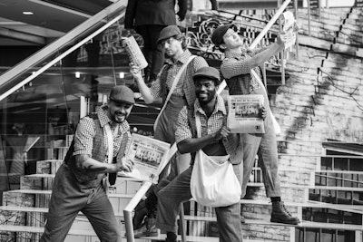 Newsboys dressed in vintage apparel also helped set the scene.