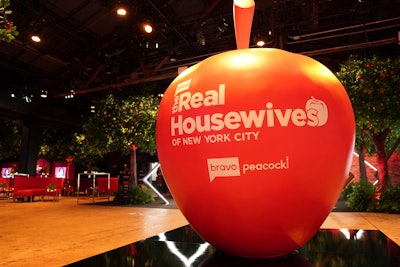 An oversize apple greeted guests at the entrance of the event space. “The overall theme of the Big Apple Orchard really lent itself to some ripe experiences and creative design,' said Skonieczny.