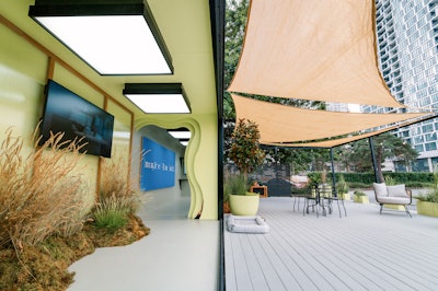 With greenery enhancing the natural aesthetic, the versatile space incorporates a 12-by-5-foot lenticular wall and digital screens to convey Bosa's brand messaging. Its flexible layout intends to support diverse events, from intimate gatherings to large presentations.