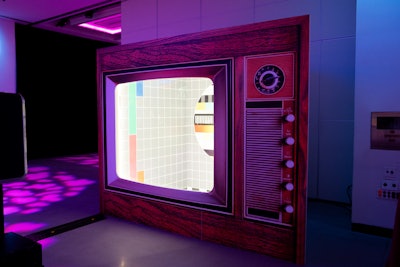 The photo booth resembled an oversize vintage TV where guests looked like they were appearing on the screen when they posed.