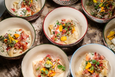 During the cocktail hour, Loews Miami Beach Hotel executive chef Christopher Aguirre cooked up soy- and pear-braised short rib dumplings with crab and bacon butter, finished with caviar.