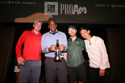 Sean Malto, Mike Redd, Jason Krech, and Jack Murphy posed with the Michelob ULTRA Pro-Am Trophy.