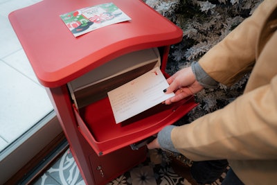 Other interactive elements include a “Letters to Mariah” station where attendees can write notes to the singer on branded postcards.