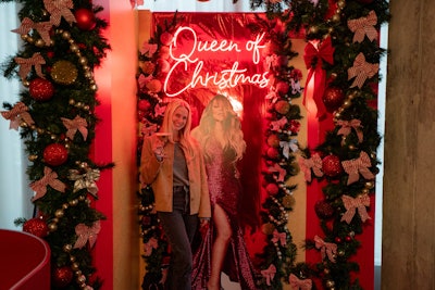 Attendees can pose for photos with a life-size cutout of Carey at each location.