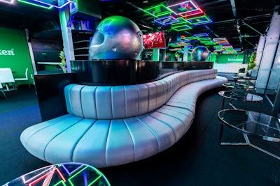 Last year's F1 Las Vegas Grand Prix was chock full of inspiring race car decor. The racing company tapped Blueprint Studios to design and produce its three official hospitality spaces. One of our favorites? This space, sponsored by Heineken, which took on a “Neon House” theme and featured programming by Corso Marketing Group. The neon-inspired space made an impact with oversize driver helmets as decor. See more: Formula 1 Las Vegas Grand Prix: Behind the Scenes of the Race's Biggest Events