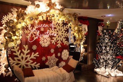 In Chicago, attendees can pose with a neon sign that spotlights Carey’s “Queen of Christmas” title alongside a Christmas tree designed with bottles of Black Irish liqueur.