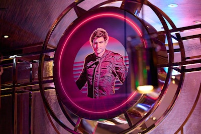 The neon-lit venue featured photos of the driver, who signed autographs and took photos with hundreds of fans.