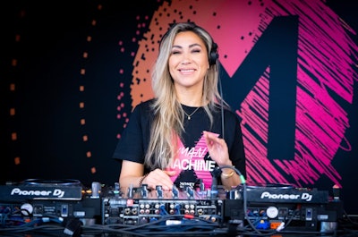 A DJ was stationed in the walkways to keep energy high as guests moved throughout the space.