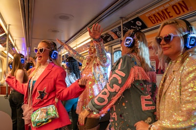 Attendees rock out at a silent disco inside a full-size Toronto subway car.