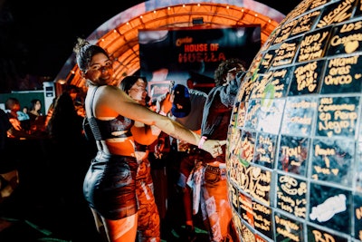 Guests were encouraged to leave their mark by writing messages on mirrored tiles to contribute to a massive disco ball that illuminated during Balvin’s set.