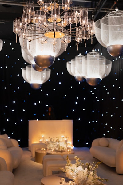 Four styled hallways showcased curated collections of furniture, draping, and decor, including rustic wood accents, bold mustard tones, and striking silver chandeliers. Entertainment by Elan Artists and Hollywood Photo Booth’s AI Roamer technology added interactive moments for attendees.