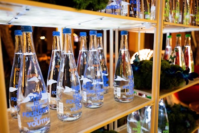 Guests took home limited-edition Evian bottles that said “This is the Fountain of Youth,” in collaboration with Pharrell Williams.