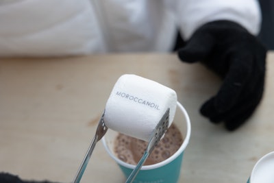 Complimentary hot chocolate with branded marshmallows was served in the space, which was intended to drive brand awareness, sales, and a festive atmosphere.