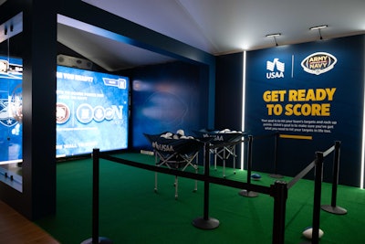 At the multiball, multiplayer football toss, attendees threw footballs at targets on a large LED touchscreen.