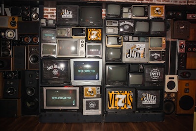 The speakeasy-style On The Record venue at Park MGM Las Vegas was transformed into Jack’s Garage for an evening featuring live music, local eateries, unique stations celebrating McLaren Racing, and signature Jack Daniel’s cocktails. The event took advantage of the quirky venue's unique decor, adding branding to elements like a wall of retro TVs.