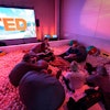 The 2015 TED Conference in Vancouver brought a playful twist to its lounges, where attendees could watch speaker simulcasts. A standout was the new ball pit, filled with beanbag chairs and beach balls, offering a relaxed and whimsical setting to absorb big ideas while fostering creativity and connection.