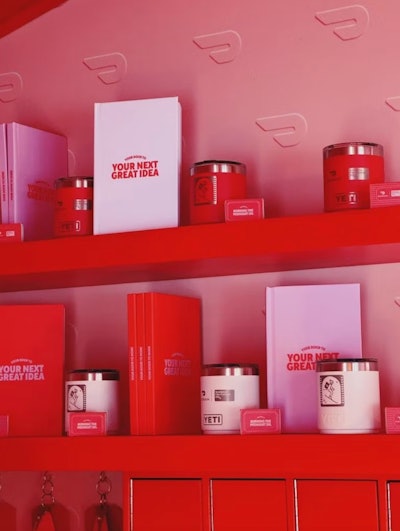 Also at Sundance 2024, DoorDash hosted an outdoor activation that served as an on-site concierge for festivalgoers to get essentials during their time in Park City, along with hot cocoa and surprise-and-delight perks. Tying into the idea that DoorDash is your 24/7 life assistant that can anticipate all of your needs, the activation was a mix between a classic box office and a bespoke hotel front desk; it provided attendees with anything and everything they might need while in Park City—including eye drops, hand warmers, ChapStick, Advil, and more.