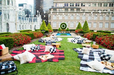 To celebrate fashion designer Adam Lippes' 2015 buffalo plaid-inspired collection for Target, David Stark Design used Lippes' Berkshires home and personal style—and other notable households of the region like that of Edith Wharton—as inspiration to transform a New York venue's outdoor space into a cozy picnic setting. While the event was held in August, the blanket- and pillow-filled space offers great inspiration for winter events; picnic baskets held additional Adam Lippes blankets and thermoses. See more: How to Throw a Plaid Picnic