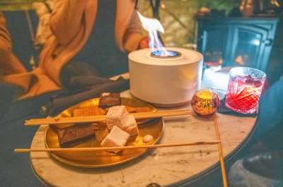 Guests at Somewhere Nowhere's teardrop igloos are gifted a bottle of Champagne; other treats, like tabletop s'mores and caviar bites, can be ordered.