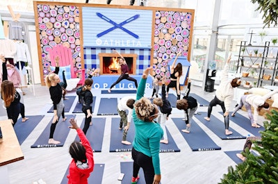 On-site fitness classes can be a great way to warm guests up, like this one at PopSugar’s “Sugar Chalet,' held in New York in November 2019. The indoor wintry setting, designed by David Stark Design, was decked out in colorful plaids, cozy decor, and lodge-inspired features such as a giant hearth with rainbow-hued “logs.' In addition to morning yoga sessions, visitors could enjoy a hammock with fuzzy blankets and furry pillows, plus warm, fizzy Sambucus elderberry drinks. Over the course of the one-day event, about 1,500 visitors passed through the Sugar Chalet. See more: See Inside PopSugar’s Whimsical Sugar Chalet