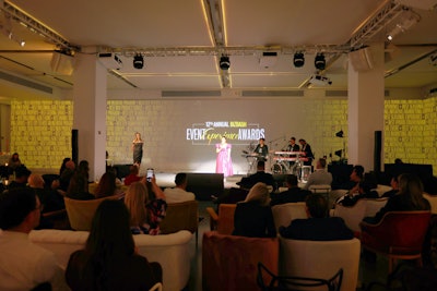 Along with pretzel chairs and rounds with printed linens, guests could relax during the show on plush furniture from Something Vintage.