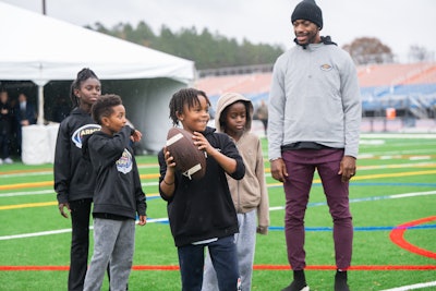 Before the game, USAA hosted nearly 100 military kids and caregivers at a football camp alongside former Washington Commanders quarterback Robert Griffin III and therapy dog Ellie.