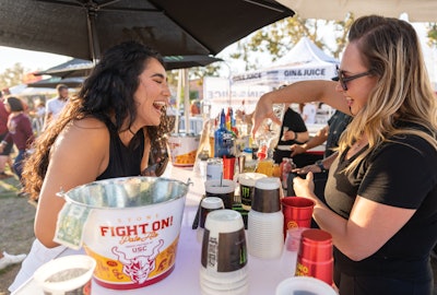 During USC football games, beverages are served in Better for All's reusable, renewable, and certified home-compostable cups.