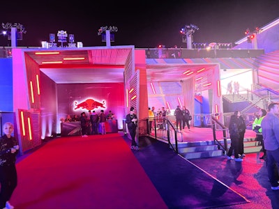 ASV also created a custom-built, wood-slatted entrance and structure that supported guest registration, along with display cases to showcase driver suits and Olympic medals/artifacts, a new WIIINGS FOR YOUR WINTER display platform to showcase one of several F1 cars on site, custom drink rails, and more.