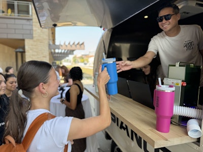 At Studio H2O, a custom engraving station allowed guests to give their Stanley bottle a one-of-a-kind touch. 'When someone sees a cool brand experience and gets to personally interact with it, you better believe when they see that brand in stores next it is now their favorite brand!” Hill said.