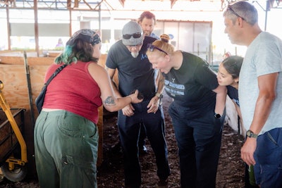 The team donates plant-based scraps to a local worm farm.