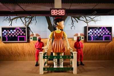 Squid Game: The Experience in NYC allows fans to enter the world of the series and participate in the games they’ve seen on screen, including 'Red Light, Green Light' under Young-hee’s watchful eye.