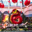 In the North Bed, a 28-foot floral serpent honors the Year of the Snake. Red and gold silk lanterns hang above, while a koi fish fountain spouts water into a tranquil pond.