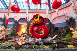 In the North Bed, a 28-foot floral serpent honors the Year of the Snake. Red and gold silk lanterns hang above, while a koi fish fountain spouts water into a tranquil pond.