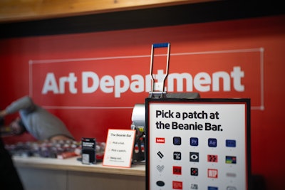 Guests could customize beanies with Adobe-related icon patches.