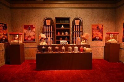Upon arrival at a replica of Atlanta’s Fox Theatre, visitors were treated to a nostalgic concession stand, complete with popcorn and a selection of candies. Guests then stepped into a green screen photo moment, allowing them to immerse themselves in a football-themed movie scene of their choosing. With an assortment of branded CFP props like letterman jackets, bullhorns, and pompoms, attendees became the star of the film. Each guest walked away with a printed movie poster featuring their personalized moment.