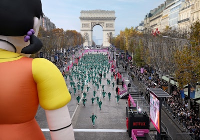 On Dec. 1, Netflix organized a giant 'Red Light, Green Light' game on the Champs-Élysées in Paris with 456 randomly selected participants dressed in the show's signature green tracksuits.