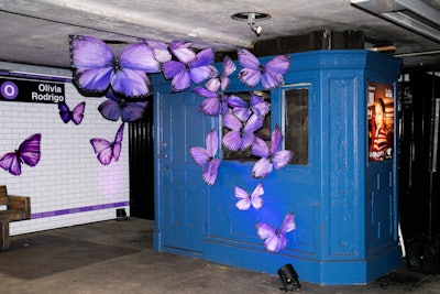 A preexisting ticket counter kiosk inside the retired subway station became part of a three-dimensional butterfly installation—a nod to Rodrigo's frequent use of the creature through her music and style.