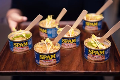 The event also gave a nod to the decade through era-specific food and drinks with modern twists. Smithsonian Channel and Advantage crafted a menu that included Spam fried rice served in Spam cans; mini Jell-O molds; gimlets and Manhattans; and dishes including turkey and beef with veggies, meatloaf sliders, and shrimp cocktails served on TV dinner trays. See more: Smithsonian Channel Took Guests Back to 1969 for a Moon Landing Celebration