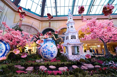 In the South Bed, cherry blossom trees with pink and white blooms are complemented by intricate blue-and-white “qinghua” porcelain sculptures. A 33-foot-tall blue-and-white porcelain pagoda hosts The Garden Table, an intimate, bookable dining experience where guests can enjoy a dim sum lunch or dinner feast curated by Bellagio’s Pan-Asian restaurant, Noodles.