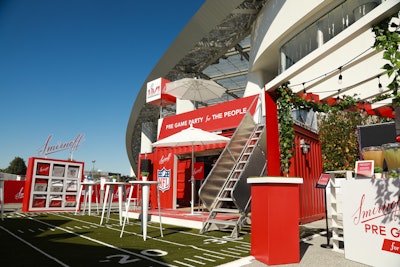 Beverage brand Smirnoff hosted the Smirnoff House for ticket holders on game day. Located steps from the entrance to SoFi Stadium, the 40-by-50-foot activation, designed and produced by Rose Gold Collective, featured a shipping container transformed into a backyard bar, complete with a custom tic-tac-toe game. Read the full 2022 recap: Super Bowl LVI: 38 Event Highlights From the Biggest Parties and Brand Activations