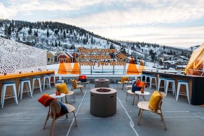 Festivalgoers were able to relax by a fireplace on an outdoor terrace, complete with a cozy heated yurt.