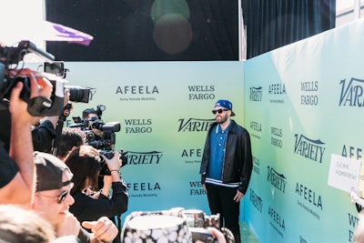 The arrivals had brat-green carpeting and a blue-to-green ombre step-and-repeat, while the prefunction space was created within the main space, using brat-green sheer panels to separate it from the main area.