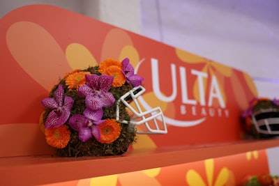 Attendees visited Ulta Beauty’s Beauty Bar to elevate their look with top hairstylists and makeup artists, and visited a dedicated snack station featuring local brand Zapp’s signature chips. Music by The Young PinStripe Brass Band provided an upbeat vibe, while guests could partake in fun product giveaways and capture memories with unique photo moments. Fun props—like floral-covered football helmets—added to the gathering's feminine vibe.